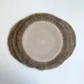 Round woven jute placemat in ivory and tan with layered brown fringe edges, shown flat - 37cm Approx 60g / Milk Coffee (Jute Tassel)