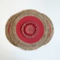 Round woven table mat in red and gold, with a beige fringe edge and braided center detail - Red (Jute Tassel)