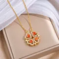Goldene Kleeblatt-Halskette mit herzförmigen Kristallblättern und orange-roten Mittelsteinen - Gold Orange (X2706) / Gold und Orange