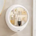 Wall-mounted makeup organizer in ivory white with a clear front cover, shown with size dimensions - Round / Ivory