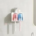 White wall-mounted toothbrush holder with two transparent cups in red and blue, shown front-on - 2 Cups Toothbrush Holder