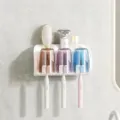 White wall-mounted toothbrush holder with three translucent cups in brown, purple, and blue - 3 Cups Toothbrush Holder