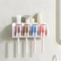 White wall-mounted toothbrush holder with four tinted cups and electric brushes on display - 4 Cups Toothbrush Holder