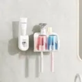 White wall-mounted toothbrush holder with red and blue cups and automatic toothpaste dispenser - 2 Cups Toothbrush Holder + Dispenser