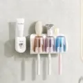 White wall-mounted toothbrush holder with automatic toothpaste dispenser and three tinted cups - 3 Cups Toothbrush Holder + Dispenser