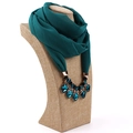 Detail of emerald green chiffon scarf necklace with ornate jewel pendant on a bust - Orchid Green