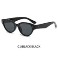Occhiali da sole cat eye Y2K con montatura nera lucida, lenti grigio scuro e borchie - Montatura Nera Lenti Grigio Nero