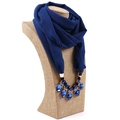 Detail of navy blue chiffon scarf featuring a luxury gemstone necklace pendant accessory - Royal Blue