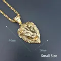 Detailed close-up of small size gold-plated lion head pendant with sparkling crystal eyes - Small