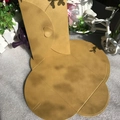 Detailed view of golden pearlescent envelopes featuring a romantic heart-shaped clasp closure - Pearlescent Gold