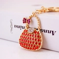 Luxury rhinestone handbag keychain with red crystals and purple bow charm gold metal - 5.5*4 / Red