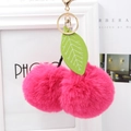 Cute bright pink cherry fur pompom keychain with green leaves and gold metal clip - Rose Red