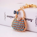 Creative gold metal handbag keychain with blue and clear rhinestones on a white book - 5.5*4 / Blue