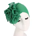 Detail of emerald green turban hat with a large layered mesh rose flower on the side - Grass Green