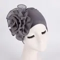 Detail of elegant dark grey headscarf featuring a large layered mesh flower for women - Gray