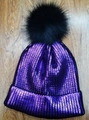 Winter purple metallic knit beanie hat featuring a large black faux fur pom pom - Adult / Purple