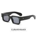 Gafas de sol rectangulares negras retro con detalles de flechas doradas y estrellas - Montura Negra Lentes Gris Negro