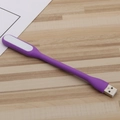 Portable purple USB LED mini night light with flexible silicone body on wooden surface - Purple