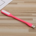Portable pink USB LED mini night light with flexible neck on wooden desk surface - Pink