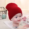 Toddler warm knitted beanie hat in solid red color for autumn and winter seasons - Adjustable / Wine Red