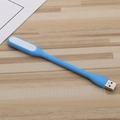 Flexible blue USB LED night light made of silicone on a light wood background - Light Blue / Bare Unit