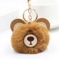 Detail of cute brown bear plush keychain with soft faux fur and gold metal hardware ring - Khaki