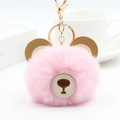Close-up of pink faux fur bear keychain with brown leather ears and golden metal ring - Light Pink