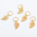 Detailed view of five golden hollow leaf charms for hair braids on white background - Leaf / Gold Leaf (6265)