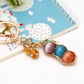Peapod and peanut keychain featuring colorful cat's eye stones and sparkling rhinestones - Single OPP Bag Packaging / Cat Eye Stone Peanut Colorful
