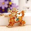 Golden Kirin keychain with enamel finish and sparkling crystals for car keys and bags - Yellow Lucky Kylin
