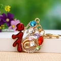 Golden Fu character keychain with colorful rhinestones and red enamel for bags - Single OPP Bag Packaging / Colorful Rhinestone Fu