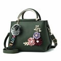 Dark green pebble leather handbag with 3D floral accents and golden ring handle - Grass Green