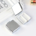 Silver round metal pill box with mirror and two internal compartments for travel - Rounded Square 2-Grid