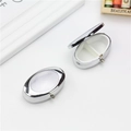 Portable silver oval metal pill box with dual compartments shown open and closed - Oval Window 2-Grid