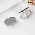 Silver oval metal pill box with mirror finish and two compartment divider - Oval 2-Grid Detachable
