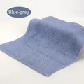 Blue-grey cotton face towel with absorbent looped texture and wavy woven border - 34x34cm / Blue Gray