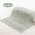 Soft light green cotton square towel with elegant honeycomb pattern and terry loops - 34x34cm / Light Green