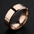 Macro detail of rose gold mirror polished stainless steel ring on leather surface - Rose Gold