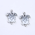 Detail of white enamel sea turtle connectors with silver frames for DIY jewelry - Clear White