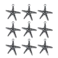 Macro detail of nine silver starfish alloy pendants with textured finish on white background - Starfish B 22x26mm