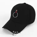 Detail of black baseball cap featuring iconic red and green stripe with silver metal rings - Snap Button with Ring and Webbing
