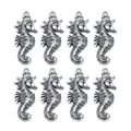 Detailed macro view of eight seahorse-shaped metal pendants with antique silver finish - Seahorse 37.5x15mm