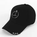 Detail of black cotton baseball cap with silver metal rings and hanging chain accessory - Ring with Horizontal Bar Pendant