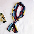 Detail view of a long satin scarf featuring vibrant geometric patchwork and glossy finish - 5 Long Navy Blue