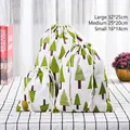 Three sizes of cotton linen drawstring bags featuring green tree print patterns - Triangle Tree