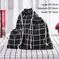 Three-piece black plaid cotton linen drawstring storage bags in various sizes - Black Plaid