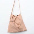 Detail view of pink canvas tote bag featuring double handles and a long shoulder strap - Flesh Pink