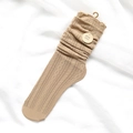 Khaki cable-knit slouch socks with openwork texture and ruffled cuffs in a flat lay - One Size / Khaki