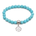 Turquoise 8mm beaded bracelet with silver lotus flower pendant on white background - Silver Lotus Pendant / 8mm Bead Diameter / Green