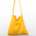 Detailed view of heavy canvas texture and stitching on the bright yellow tote bag - Dark Yellow